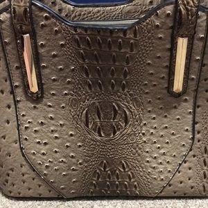 Like leather tan and dark brown fancy purse!